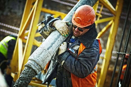 aro autonomous robotics worker carrying heavy pipe